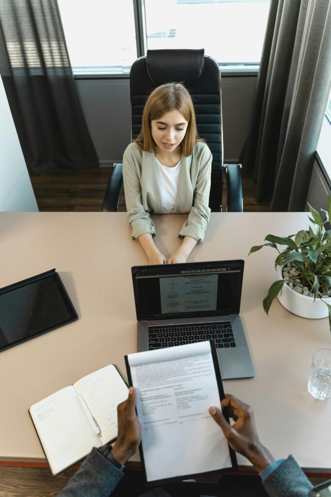 pexels-photo-5439152-5439152 High-angle view of a job interview in a modern office setting, capturing professionalism.